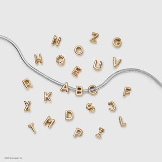 Our iconic alphabet charms, now in 14k gold plating with a fresh new look and size. Perfect for personalizing your summer style.